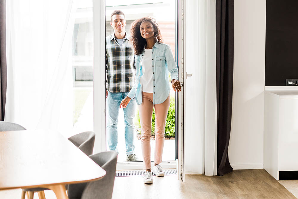 Couple looking at a home to buy before scheduling home inspection services 